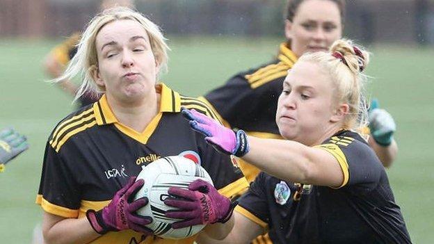 Neve Jones puts in a challenge during a game for East Belfast GAA