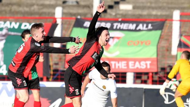 A delighted Conor McMenamin seals a 2-0 win for Glentoran against Carrick Rangers at the Oval