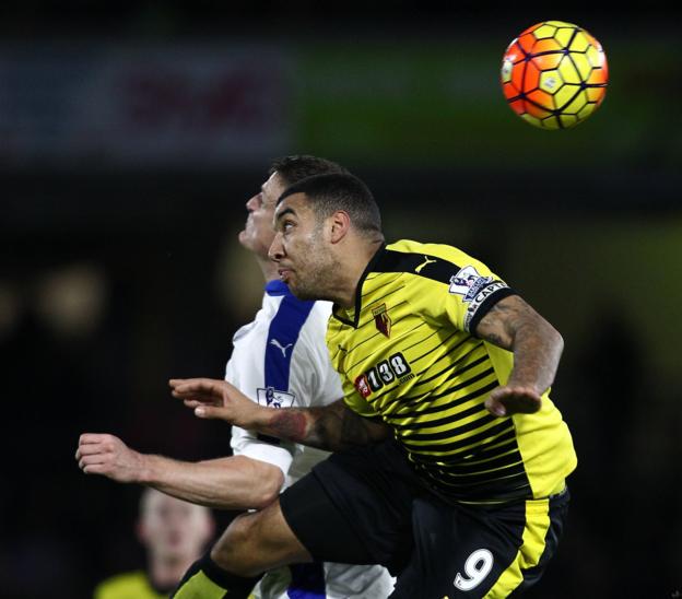 Troy Deeney challenges Robert Huth during Leicester's 1-0 win over Watford at Vicarage Road in March