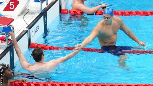 Reece Dunn and Gabriel Bandeira shake hands after their race