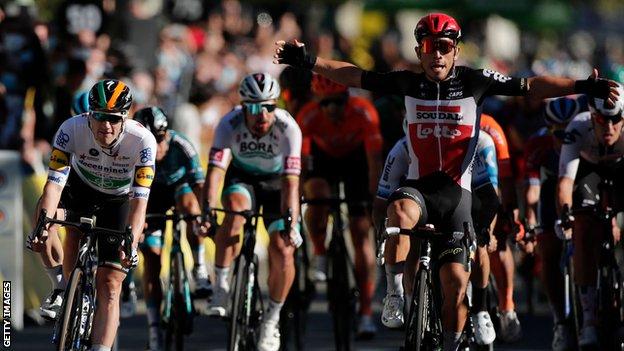 Australia's Caleb Ewan (right) puts his arms up in celebration after beating Ireland's Sam Bennett (left) in a bunch sprint on stage three of the 2020 Tour de France