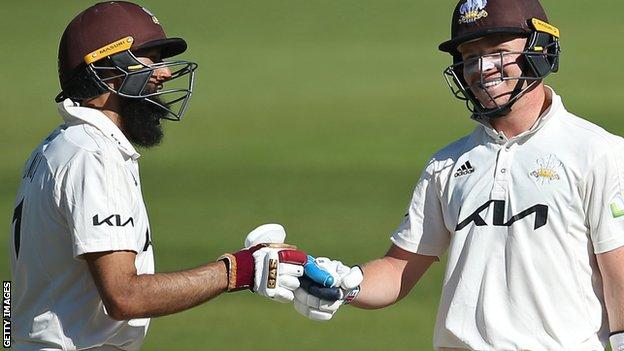 Surrey batters Hashim Amla and Ollie Pope