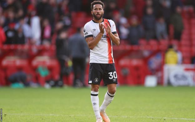 Andros Townsend claps the fans