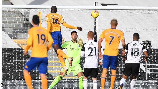 French midfielder Abdoulaye Doucoure rises unchallenged to head Everton's third goal against Fulham at Craven Cottage