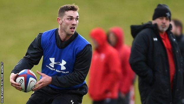 George North in training with Wales with coach Warren Gatland looking on
