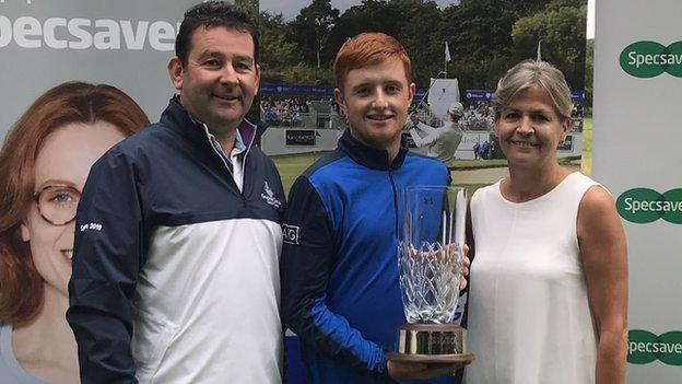 Ronan Mullarney received the NI Amateur Open trophy from Galgorm Castle captain Peter Daly and Valerie Penney from Specsavers Ballymena