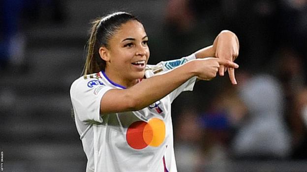 Lyon Delphine Cascarino celebrates scoring against Benfica in the Women's Champions League quarter-finals