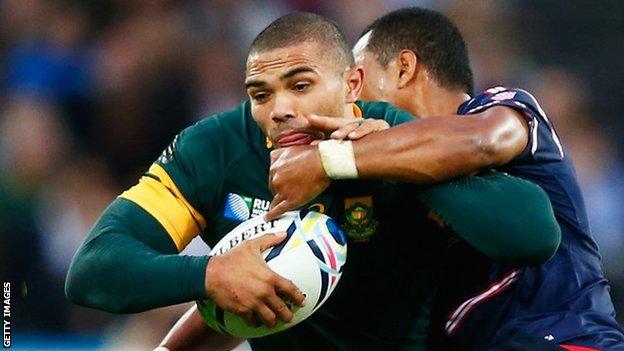 Bryan Habana of South Africa is tackled by Shalom Suniula of the United States