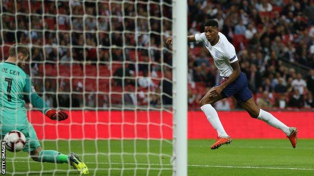 Marcus Rashford scores for England