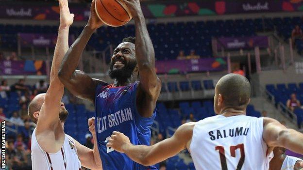 Gabe Olaseni (centre) goes to the basket against Belgium