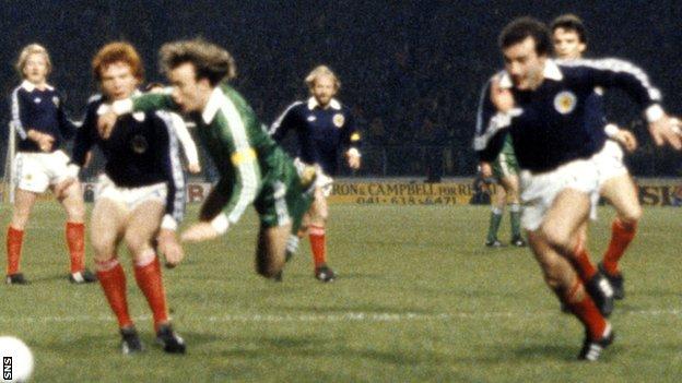 Alex McLeish (left) fouls Northern Ireland's Sammy McIlroy as Willie Miller (right) looks on during a World cup qualifier in 1981