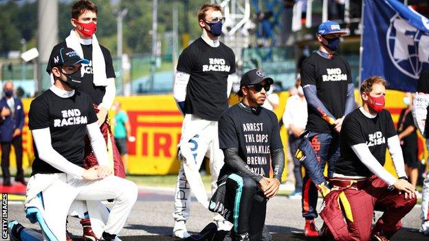 Lewis Hamilton and other drivers wear 'End Racism' T-shirts at a race