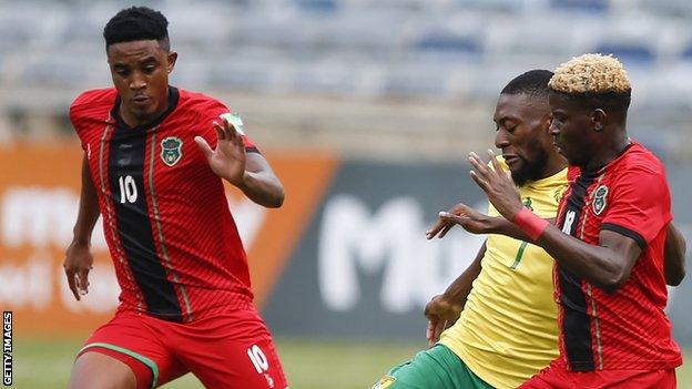 Malawi players in action against Cameroon in World Cup qualifying