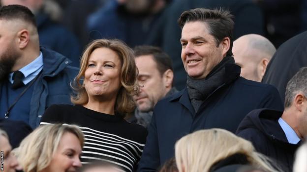 Premier League chief executive Richard Masters (right) watches a game alongside Newcastle director Amanda Staveley (left)