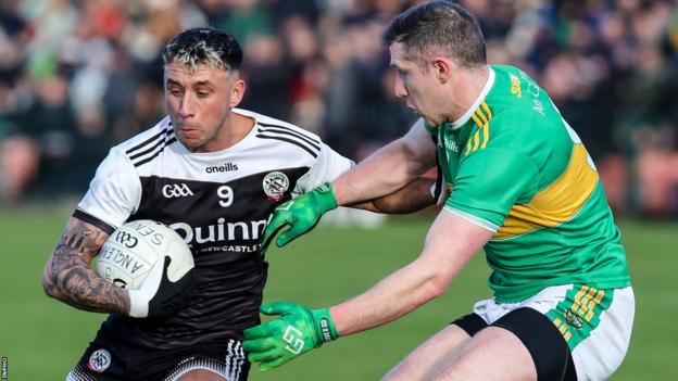Glen's Emmett Bradley battles with Kilcoo's Dylan Ward at the Athletic Grounds