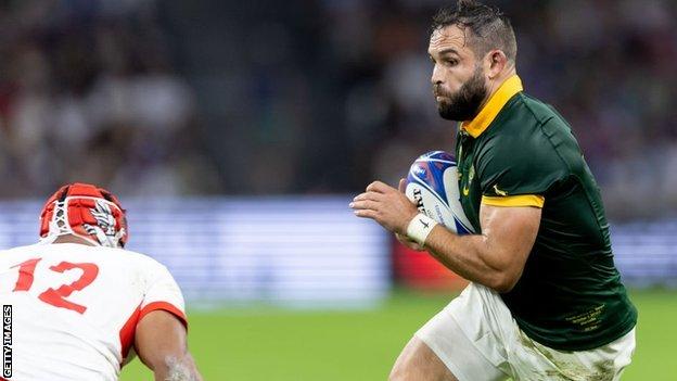 Cobus Reinach of South Africa runs with the ball against Tonga