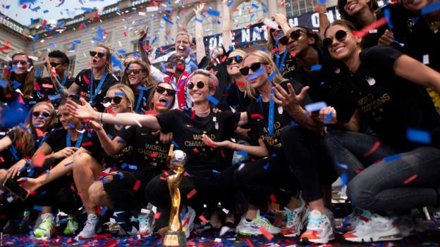 Members of the World Cup-winning US women's team take part in a ticker tape parade for the women's World Cup champions on July 10, 2019 in New York. - Tens of thousands of fans are poised to pack the streets of New York on Wednesday to salute the World Cup-winning US women's team in a ticker-tape parade. Four years after roaring fans lined the route of Lower Manhattan's fabled "Canyon of Heroes" to cheer the US women winning the 2015 World Cup, the Big Apple is poised for another raucous celebration. (Photo by Johannes EISELE / AFP) (Photo credit should read JOHANNES EISELE/AFP/Getty Images)