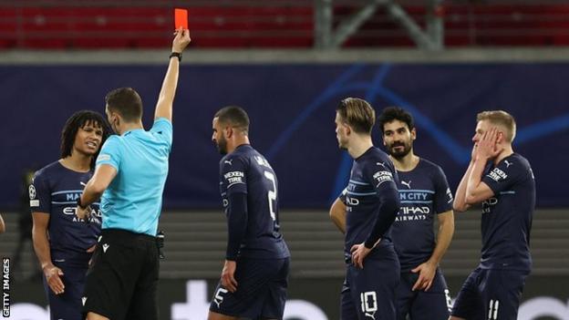 Manchester City's Kyle Walker is shown a red card against RB Leipzig