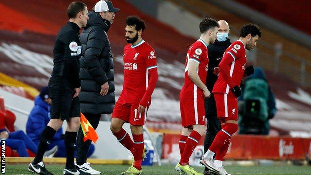 Mohamed Salah walks off the pitch as he is substituted against Chelsea