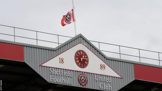 Sheffield United flag flying at half mast