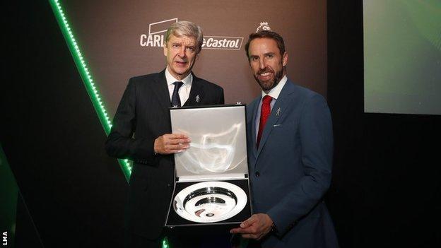 Arsene Wenger is presented with his LMA award by Gareth Southgate