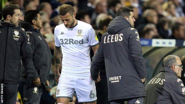 Leeds United's Liam Cooper goes off injured