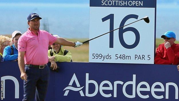 McDowell warns spectators of an errant drive in the final round