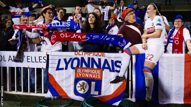 Lucy Bronze celebrating with Olympique Lyon supporters