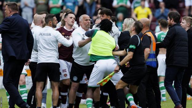 The pushing and shoving spilled onto the pitch at Tynecastle