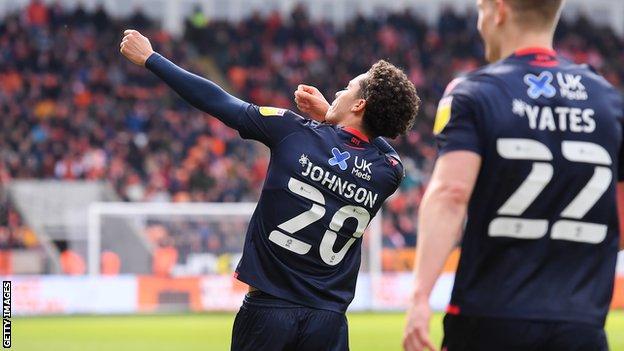 Brennan Johnson does his 'Robin Hood' goal celebration after scoring against Blackpool