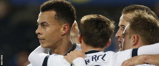 Dele Alli (left) is congratulated by team-mates after scoring at Everton