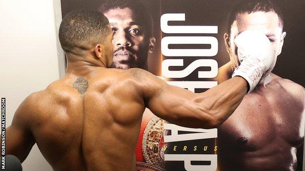 Moments after his win Joshua threw another punch, this time at a poster featuring Pulev