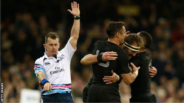 Nigel Owens awards a try during the New Zealand v France Rugby World Cup quarter-final