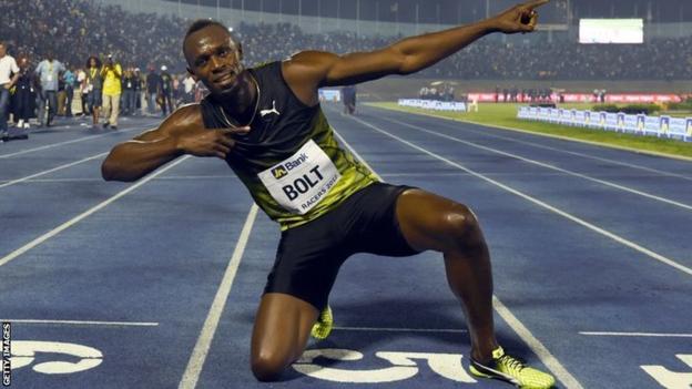 Usain Bolt celebrates on the track