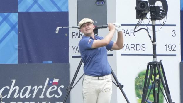 Harry Hall plays a shot at the 16th