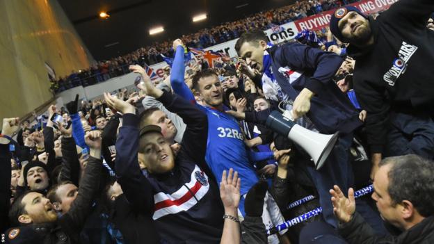 Andy Halliday celebrates with the Rangers fans