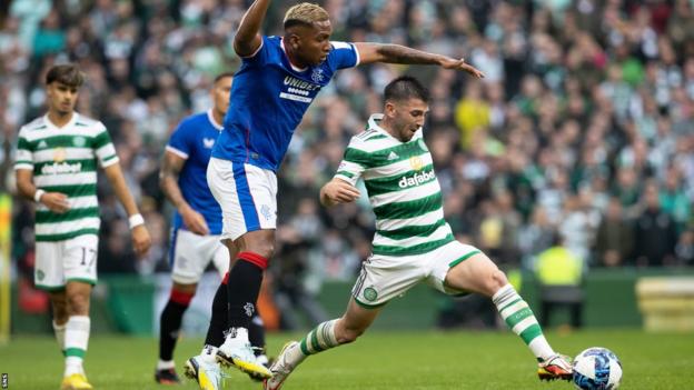 Alfredo Morelos tries to dispossess Greg Taylor