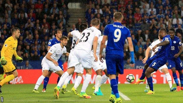 Wes Morgan (right) scores for Leicester
