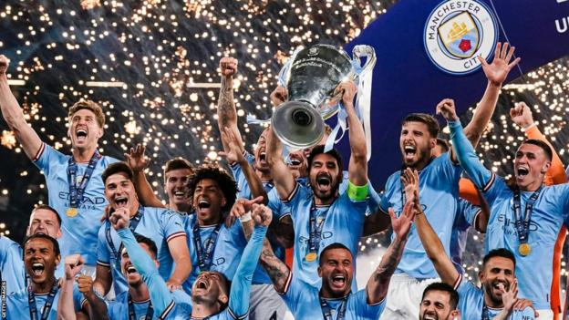 Manchester City players celebrate winning the Champions League