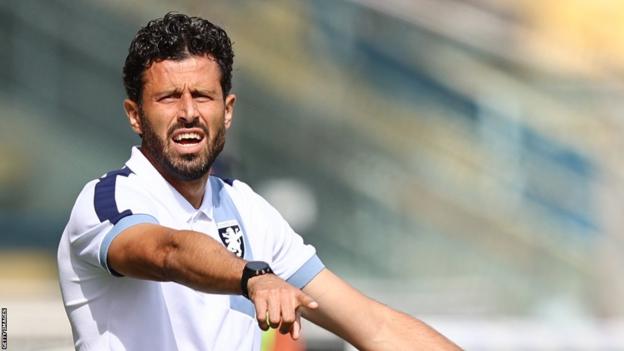 Fabio Grosso points on the touchline