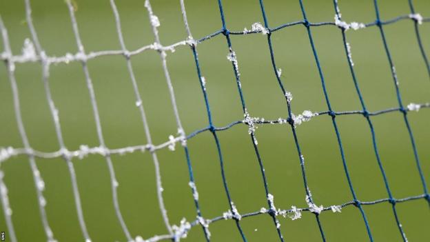 A general view of the netting of a goal on a football pitch amidst cold temperatures