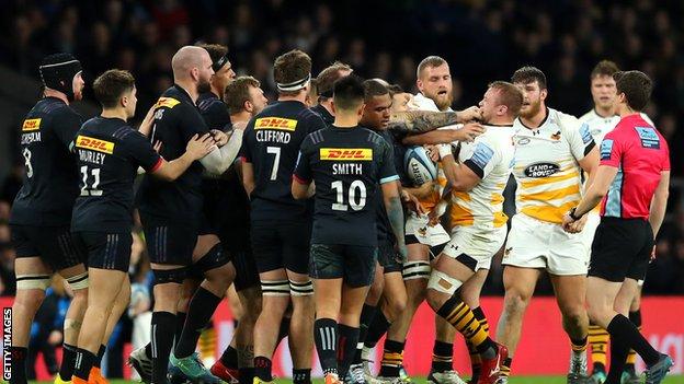 Harlequins and Wasps players clash