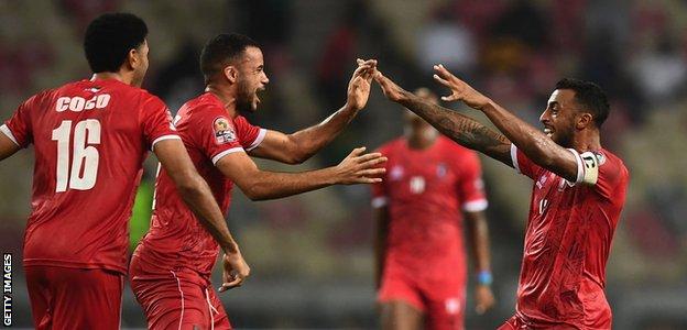 Equatorial Guinea players celebrate beating Algeria