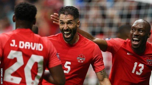 Steven Vitoria (centre) of Canada celebrates after scoring a goal to make it 2-0 during the Canada v Curacao CONCACAF Nations League Group C match at BC Place on June 9, 2022 in Vancouver, Canada
