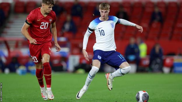 England-Under 21s wear black armbands