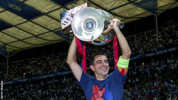 Barcelona's Xavi with the Champions League trophy in 2015