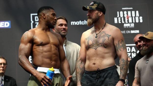 Anthony Joshua speaks to Robert Helenius astatine  their weigh-in