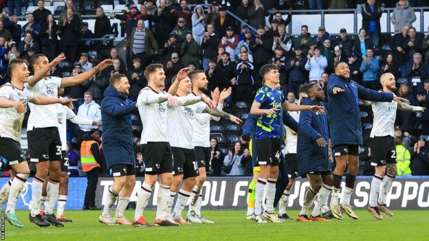Derby County players celebrate a win