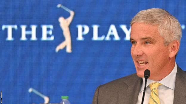 Jay Monahan, commissioner of the PGA Tour, talking at a news conference