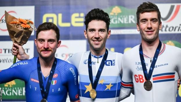 Silver medallist Italys Simone Consonni, gold medallist France's Benjamin Thomas and bronze medallist Britains William Perrett pose on the podium of the Men's Omnium Points during the UEC Track Elite European Championship in Grenchen